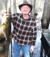 Larry Fitzgerald with a 8 pound, nine ounce bass  caught in Bayou Desiard this week on a plastic lizard