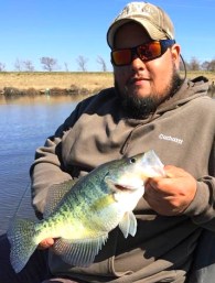 Ronnie Turner shows a nice pre-icepocalypse D'Arbonne crappie. The icechest full shown below is also his...