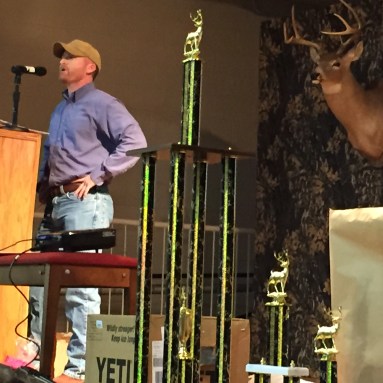 Greg Hicks shares a deer hunting story at the UP Big Buck Banquet