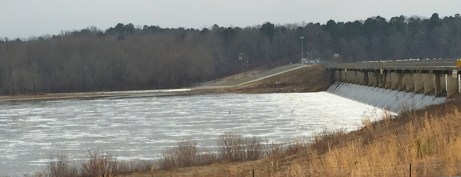 Water pouring over the old spillway in the foreground. In the background, you can see the whitewater pouring out of the new tainter gates into Bayou D'Arbonne Thursday afternoon.